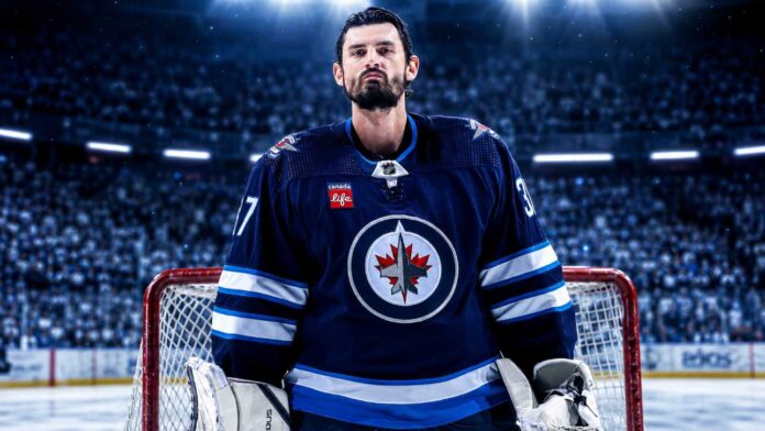 Connor Hellebuyck in a Winnipeg Jets jersey amid Buffalo Sabres trade rumors ahead of NHL training camp