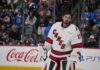Connor Hellebuyck in a Carolina Hurricanes away jersey amid Winnipeg Jets trade rumors after his public trade request