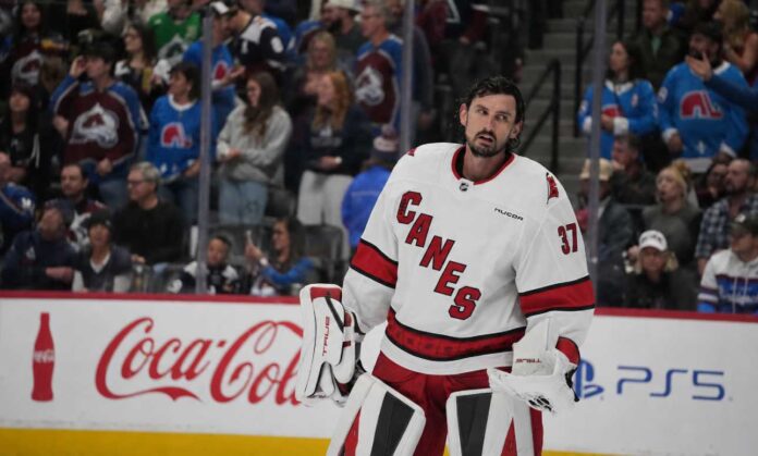 connor-hellebuyck-carolina-hurricanes-trade-rumors-2026 Connor Hellebuyck in a Carolina Hurricanes away jersey amid Winnipeg Jets trade rumors after his public trade request
