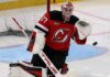 Connor Hellebuyck in a New Jersey Devils home jersey as trade rumors link the Winnipeg Jets goalie to a potential blockbuster move to New Jersey