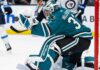 Connor Hellebuyck in a San Jose Sharks home uniform amid NHL trade rumors involving the Winnipeg Jets