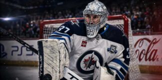 Connor Hellebuyck in a Winnipeg Jets uniform as NHL trade rumors grow over a possible training camp holdout and blockbuster trade.