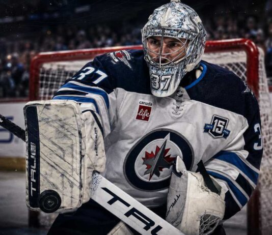 Connor Hellebuyck Trade Rumors: Could a Training Camp Holdout Force the Jets Into a Blockbuster? Connor Hellebuyck in a Winnipeg Jets uniform as NHL trade rumors grow over a possible training camp holdout and blockbuster trade.