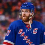 New York Rangers Linked to Connor McDavid Ahead of 2028 NHL Free Agency Connor McDavid wearing a New York Rangers home jersey amid speculation about 2028 NHL free agency