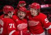 Dylan Larkin, Alex DeBrincat and Moritz Seider celebrate a Detroit Red Wings win ahead of the 2026-27 NHL season.