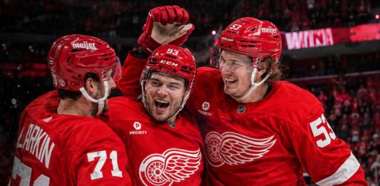 Detroit Red Wings Season Preview 2026-27: Playoff Push or Another Near Miss? Dylan Larkin, Alex DeBrincat and Moritz Seider celebrate a Detroit Red Wings win ahead of the 2026-27 NHL season.