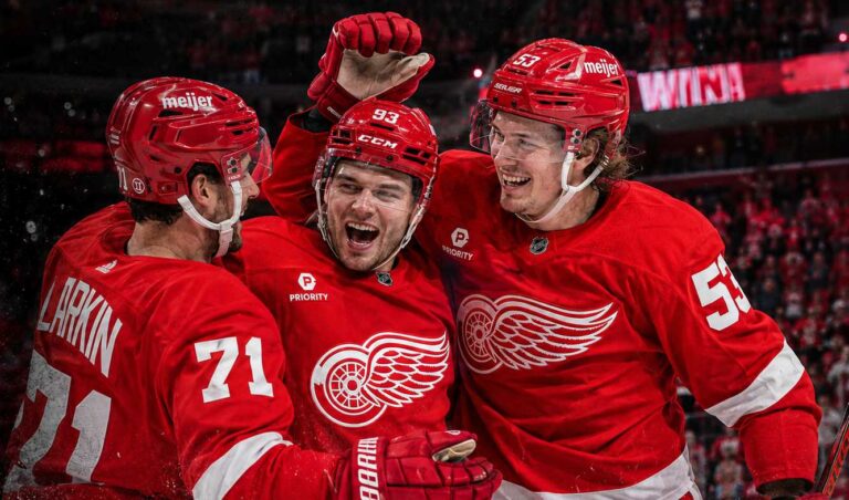 Dylan Larkin, Alex DeBrincat and Moritz Seider celebrate a Detroit Red Wings win ahead of the 2026-27 NHL season.