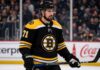 Dylan Larkin Trade Rumors: Could the Boston Bruins Convince Him to Waive? Dylan Larkin in a Boston Bruins jersey amid NHL trade rumors involving the Detroit Red Wings