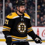 Dylan Larkin Trade Rumors: Could the Boston Bruins Convince Him to Waive? Dylan Larkin in a Boston Bruins jersey amid NHL trade rumors involving the Detroit Red Wings