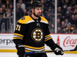 Dylan Larkin Trade Rumors: Could the Boston Bruins Convince Him to Waive? Dylan Larkin in a Boston Bruins jersey amid NHL trade rumors involving the Detroit Red Wings