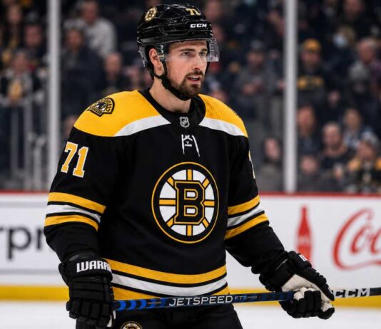 Dylan Larkin Trade Rumors: Could the Boston Bruins Convince Him to Waive? Dylan Larkin in a Boston Bruins jersey amid NHL trade rumors involving the Detroit Red Wings