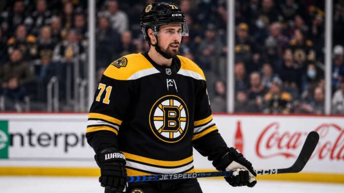 dylan-larkin-boston-bruins-trade-rumors Dylan Larkin in a Boston Bruins jersey amid NHL trade rumors involving the Detroit Red Wings