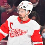 Dylan Larkin in a Detroit Red Wings jersey as trade rumors continue following a new twist in his trade request.