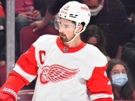 Dylan Larkin in a Detroit Red Wings jersey as trade rumors continue following a new twist in his trade request.