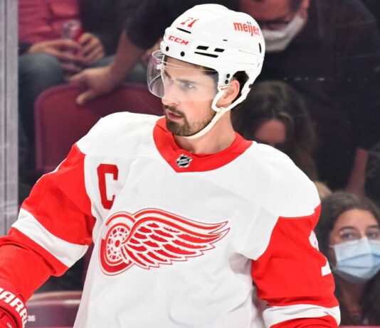Dylan Larkin in a Detroit Red Wings jersey as trade rumors continue following a new twist in his trade request.