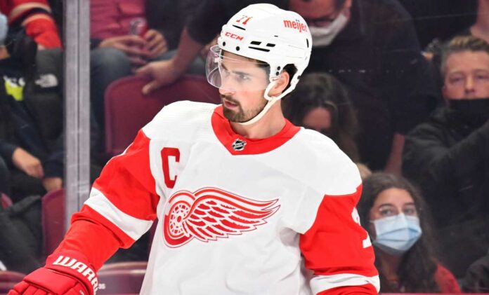 dylan-larkin-detroit-red-wings-trade-rumors-2026 Dylan Larkin in a Detroit Red Wings jersey as trade rumors continue following a new twist in his trade request.