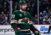 Dylan Larkin in a Minnesota Wild home jersey amid NHL trade rumors linking the Detroit Red Wings captain to Minnesota