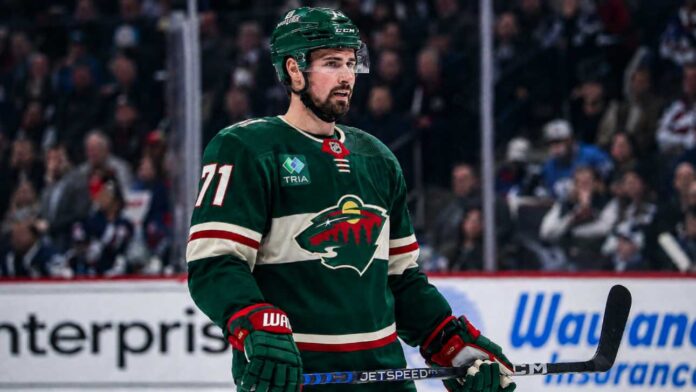 Dylan Larkin in a Minnesota Wild home jersey amid NHL trade rumors linking the Detroit Red Wings captain to Minnesota