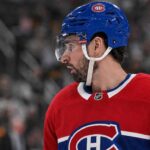 Dylan Larkin in a Montreal Canadiens jersey amid NHL trade rumors linking the Detroit Red Wings captain to Montreal