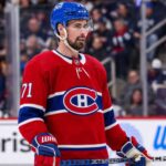 Dylan Larkin in a Montreal Canadiens home jersey amid NHL trade rumors linking the Detroit Red Wings captain to Montreal