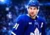John Tavares Point Projections 2026-27: Can He Deliver Another 70-Point Season? John Tavares in a Toronto Maple Leafs jersey featured in a 2026-27 fantasy hockey projection predicting 28 goals, 39 assists and 67 points.