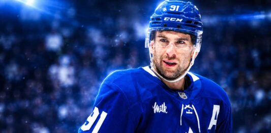 John Tavares Point Projections 2026-27: Can He Deliver Another 70-Point Season? John Tavares in a Toronto Maple Leafs jersey featured in a 2026-27 fantasy hockey projection predicting 28 goals, 39 assists and 67 points.