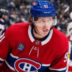 Kent Johnson to Montreal? Why the Canadiens Could Target the Blue Jackets Forward Kent Johnson wearing a Montreal Canadiens home jersey and helmet amid trade rumors linking him to the Canadiens