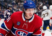 Kent Johnson to Montreal? Why the Canadiens Could Target the Blue Jackets Forward Kent Johnson wearing a Montreal Canadiens home jersey and helmet amid trade rumors linking him to the Canadiens