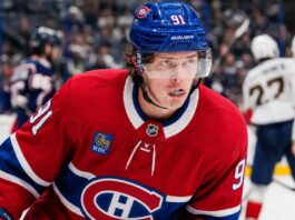 Kent Johnson to Montreal? Why the Canadiens Could Target the Blue Jackets Forward Kent Johnson wearing a Montreal Canadiens home jersey and helmet amid trade rumors linking him to the Canadiens