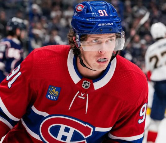 Kent Johnson to Montreal? Why the Canadiens Could Target the Blue Jackets Forward Kent Johnson wearing a Montreal Canadiens home jersey and helmet amid trade rumors linking him to the Canadiens