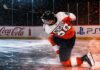 Matvei Michkov Point Projections 2026-27: Philadelphia Flyers Fantasy Outlook Matvei Michkov shooting for the Philadelphia Flyers beside Coca-Cola and PS5 board ads in a 2026-27 fantasy hockey point projection.