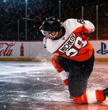 Matvei Michkov Point Projections 2026-27: Philadelphia Flyers Fantasy Outlook Matvei Michkov shooting for the Philadelphia Flyers beside Coca-Cola and PS5 board ads in a 2026-27 fantasy hockey point projection.