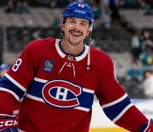Morgan Frost in a Montreal Canadiens jersey amid NHL trade rumors linking the Calgary Flames forward to Montreal