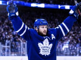 Morgan Rielly Trade Rumors Take a Major Twist for the Toronto Maple Leafs Morgan Rielly celebrates in a Toronto Maple Leafs jersey amid NHL trade rumors about his future in Toronto.