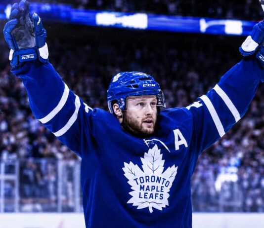 Morgan Rielly Trade Rumors Take a Major Twist for the Toronto Maple Leafs Morgan Rielly celebrates in a Toronto Maple Leafs jersey amid NHL trade rumors about his future in Toronto.