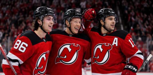 New Jersey Devils Season Preview 2026-27: Roster Changes, Predictions and Projected Standings Jack Hughes, Jesper Bratt and Nico Hischier celebrate a New Jersey Devils win ahead of the 2026-27 NHL season.