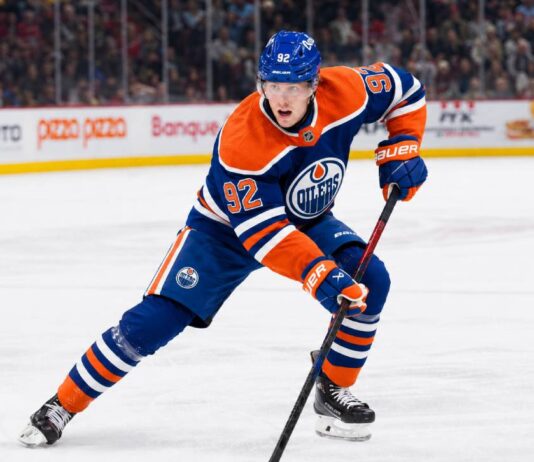 Patrik Laine wearing an Edmonton Oilers home jersey amid NHL free-agent rumors