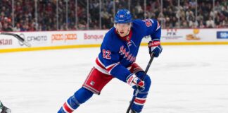 Patrik Laine wearing a New York Rangers home jersey amid NHL rumors linking him to New York as Chris Drury searches for more scoring.