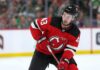 Quinn Hughes to the Devils? Why Minnesota’s Contract Clock Is Ticking Quinn Hughes wearing a New Jersey Devils home jersey in a concept image tied to his potential 2027 NHL free-agent move from the Minnesota Wild