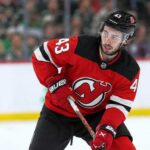 Quinn Hughes to the Devils? Why Minnesota’s Contract Clock Is Ticking Quinn Hughes wearing a New Jersey Devils home jersey in a concept image tied to his potential 2027 NHL free-agent move from the Minnesota Wild