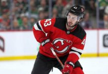 Quinn Hughes to the Devils? Why Minnesota’s Contract Clock Is Ticking Quinn Hughes wearing a New Jersey Devils home jersey in a concept image tied to his potential 2027 NHL free-agent move from the Minnesota Wild