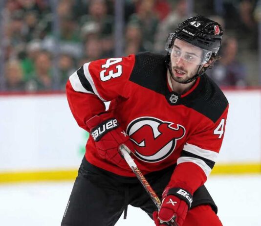 Quinn Hughes to the Devils? Why Minnesota’s Contract Clock Is Ticking Quinn Hughes wearing a New Jersey Devils home jersey in a concept image tied to his potential 2027 NHL free-agent move from the Minnesota Wild