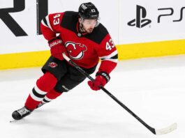 Quinn Hughes Trade Rumors: Are the Minnesota Wild Nearing a New Jersey Devils Decision? Quinn Hughes wearing a New Jersey Devils home jersey amid NHL trade rumors involving the Minnesota Wild and New Jersey Devils