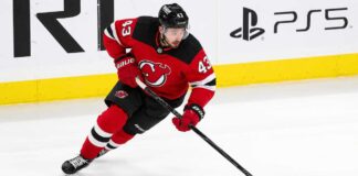 Quinn Hughes Trade Rumors: Are the Minnesota Wild Nearing a New Jersey Devils Decision? Quinn Hughes wearing a New Jersey Devils home jersey amid NHL trade rumors involving the Minnesota Wild and New Jersey Devils