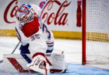Samuel Montembeault makes a save for the Montreal Canadiens as NHL trade rumors link the goaltender to the Columbus Blue Jackets.