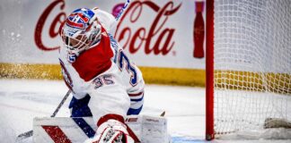 Samuel Montembeault makes a save for the Montreal Canadiens as NHL trade rumors link the goaltender to the Columbus Blue Jackets.