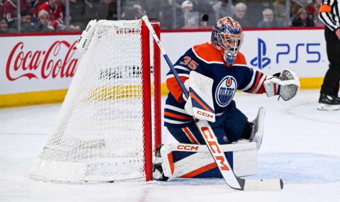 samuel-montembeault-edmonton-oilers-trade-rumors Samuel Montembeault in an Edmonton Oilers home uniform amid NHL trade rumors linking the Montreal Canadiens goalie to Edmonton after Frederik Andersen’s injury.