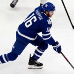 Maple Leafs Trade Rumors: Could Taylor Raddysh Leave Rangers to Join His Brother in Toronto? Taylor Raddysh in a Toronto Maple Leafs home jersey amid NHL trade rumors linking the New York Rangers winger to Toronto.