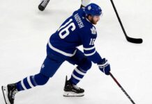 Maple Leafs Trade Rumors: Could Taylor Raddysh Leave Rangers to Join His Brother in Toronto? Taylor Raddysh in a Toronto Maple Leafs home jersey amid NHL trade rumors linking the New York Rangers winger to Toronto.