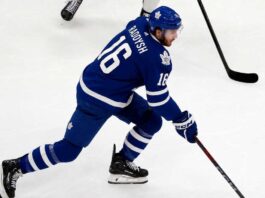 Maple Leafs Trade Rumors: Could Taylor Raddysh Leave Rangers to Join His Brother in Toronto? Taylor Raddysh in a Toronto Maple Leafs home jersey amid NHL trade rumors linking the New York Rangers winger to Toronto.